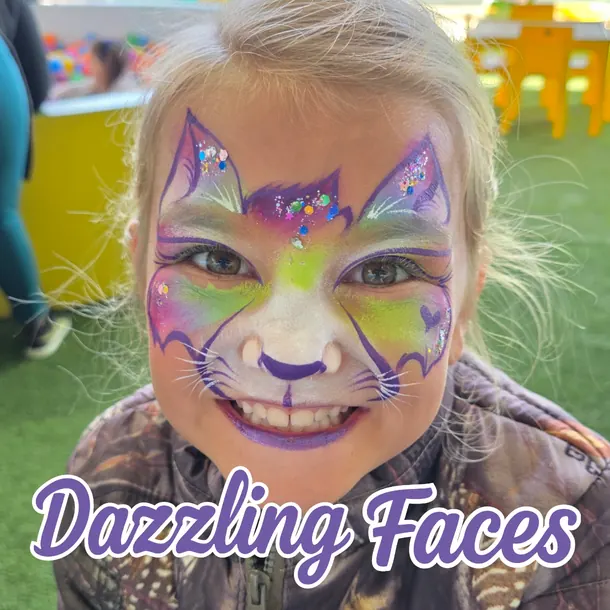 Rainbow cat face paint on a girl